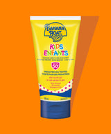 Front of Banana Boat kids SPF 50 travel size packaging on orange background.
