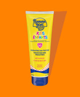 Front of Banana Boat Ultra Sport Kids lotion, showing sunscreen against a orange background.